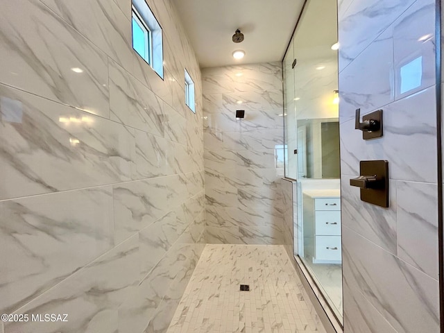 full bath with a marble finish shower