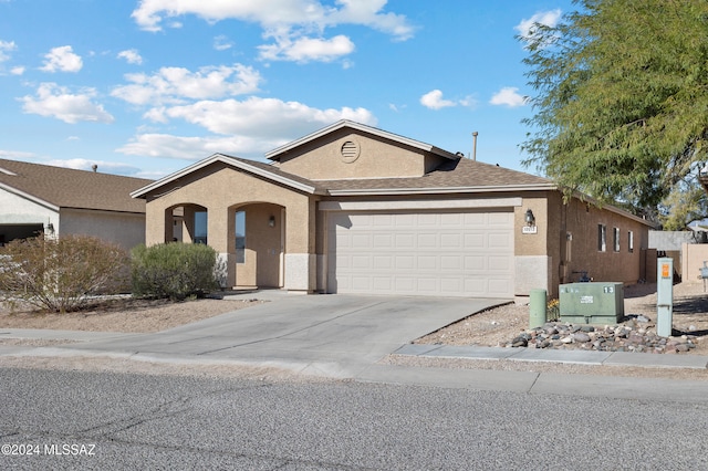 ranch-style house featuring a garage