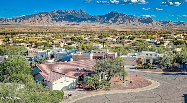 birds eye view of property featuring a mountain view