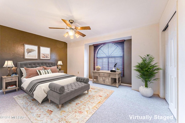 bedroom featuring ceiling fan and a closet