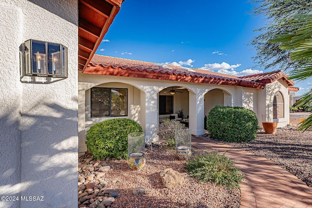 mediterranean / spanish-style home with ceiling fan