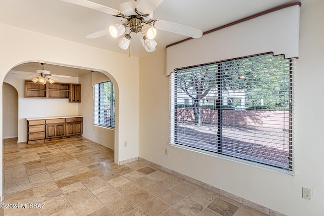 spare room featuring ceiling fan