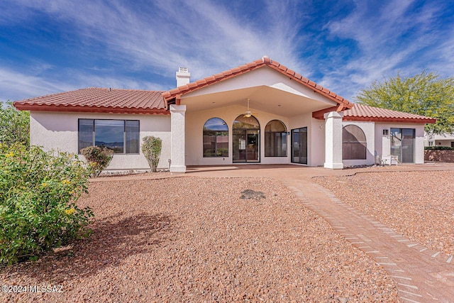 rear view of property featuring a patio area