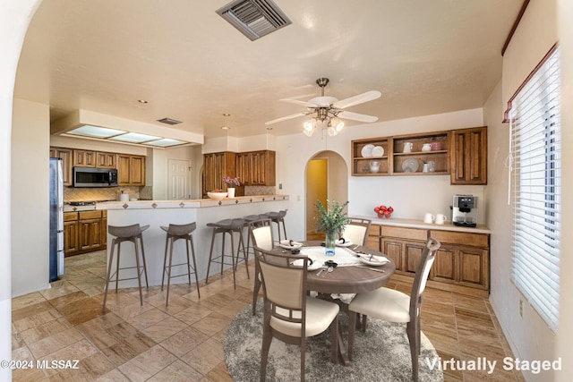 dining area featuring ceiling fan