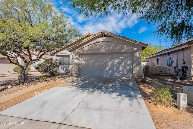 ranch-style home featuring a garage