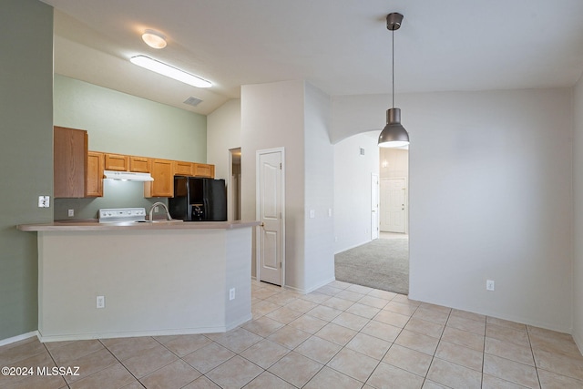 kitchen featuring hanging light fixtures, kitchen peninsula, lofted ceiling, black fridge with ice dispenser, and light tile patterned floors