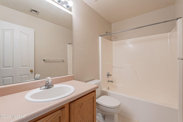 full bathroom with tile patterned flooring, shower / tub combination, vanity, and toilet