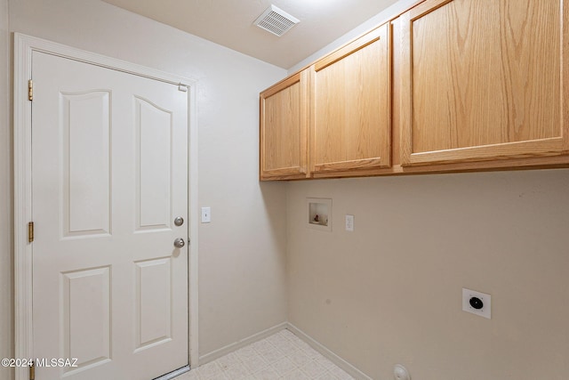 laundry area with electric dryer hookup, cabinets, and washer hookup