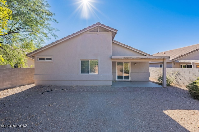 back of property with a patio area