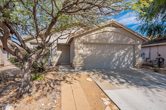 ranch-style house featuring a garage