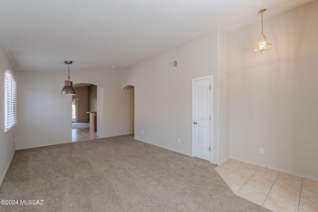 unfurnished room featuring light colored carpet