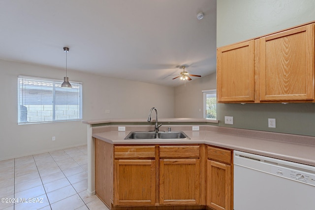 kitchen featuring pendant lighting, dishwasher, sink, ceiling fan, and light tile patterned floors