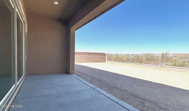 view of patio featuring fence