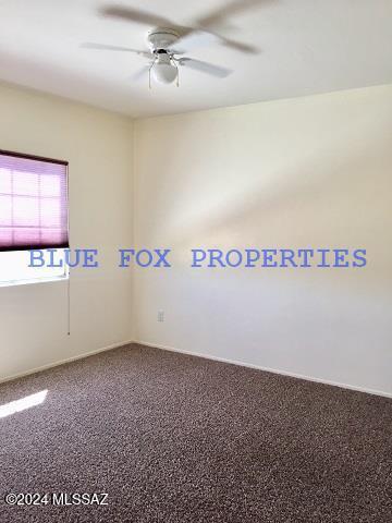 unfurnished room featuring carpet flooring and ceiling fan