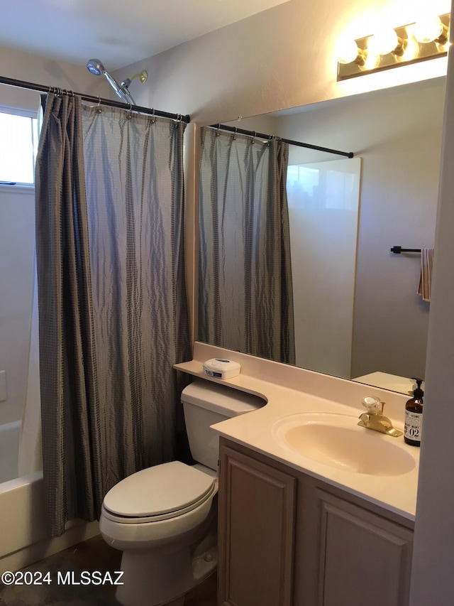 full bathroom with shower / bath combo, vanity, and toilet