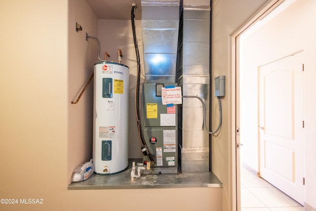 utility room with electric water heater