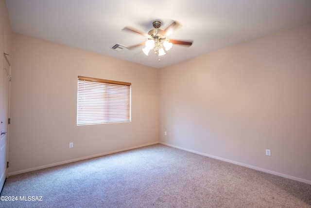 carpeted empty room with ceiling fan