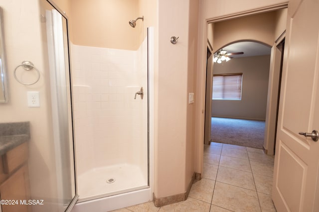 bathroom featuring tile patterned floors, ceiling fan, and walk in shower