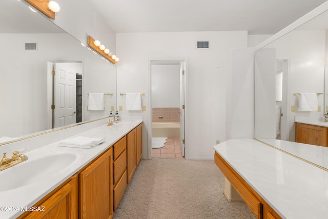 bathroom with tile patterned floors, vanity, and independent shower and bath