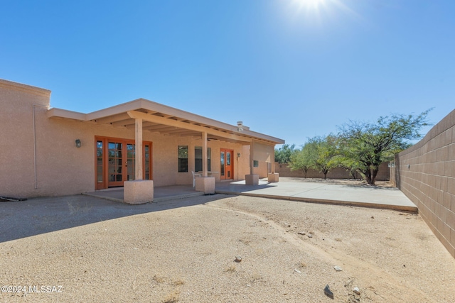 back of property featuring a patio area and french doors