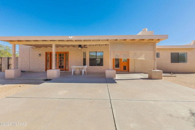 rear view of property featuring a patio and ceiling fan