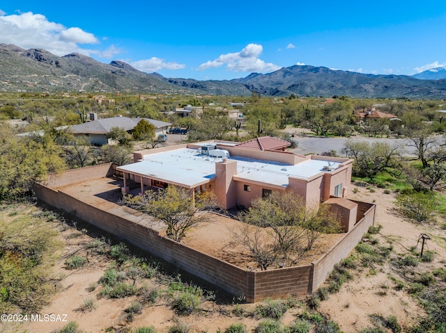 birds eye view of property with a mountain view