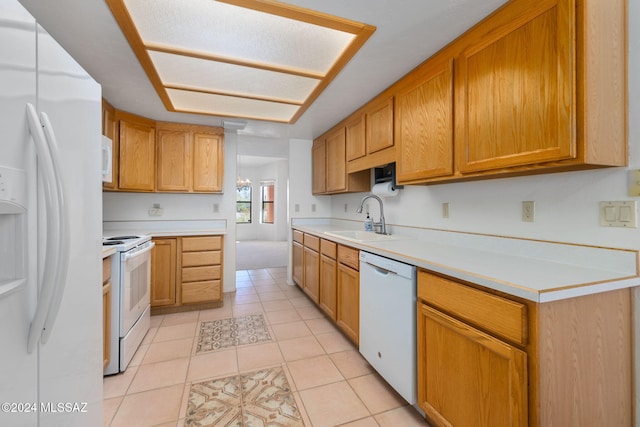 kitchen featuring light tile patterned flooring, white appliances, a notable chandelier, and sink