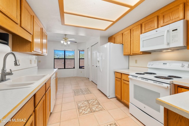 kitchen with ceiling fan, white appliances, sink, and light tile patterned floors