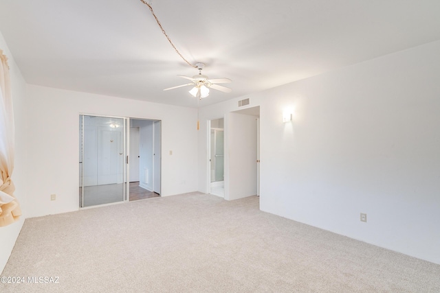 carpeted empty room with ceiling fan