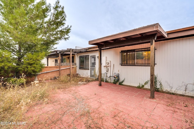 back of property featuring a patio area