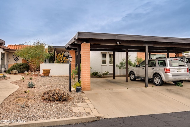 view of parking / parking lot with a carport