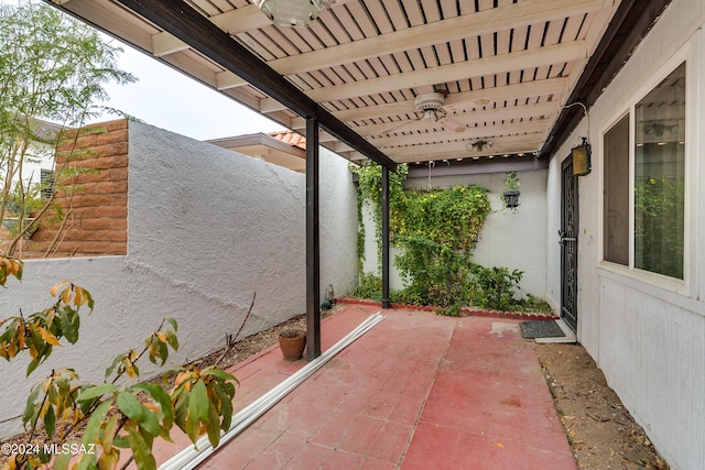 view of patio featuring ceiling fan