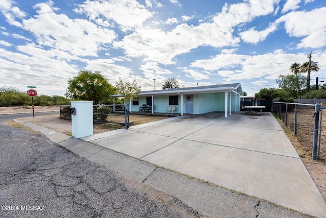 view of front of home with a carport