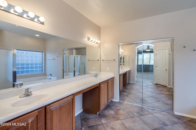 bathroom featuring tile patterned floors, vanity, ceiling fan, and plus walk in shower