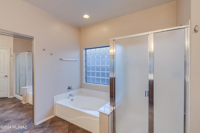 bathroom with plus walk in shower and tile patterned floors