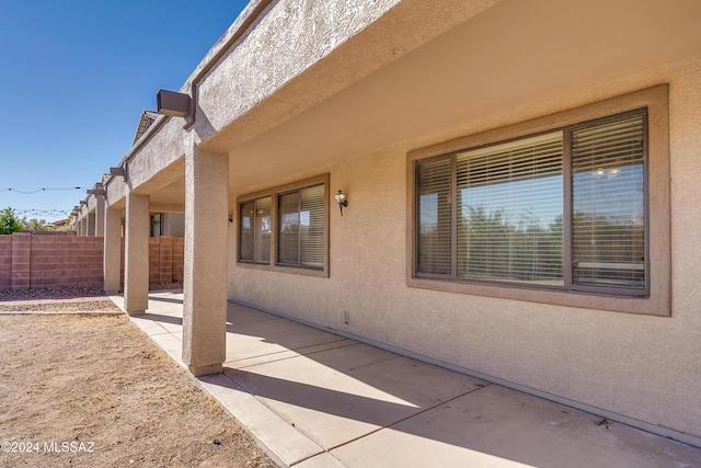 view of side of property featuring a patio