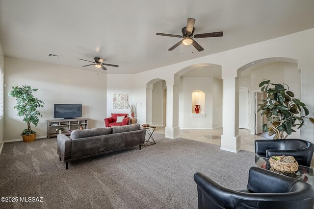 carpeted foyer with ceiling fan