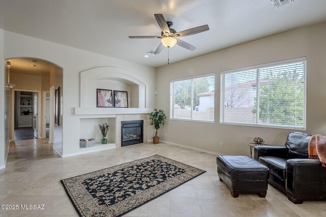 living room featuring ceiling fan and carpet flooring