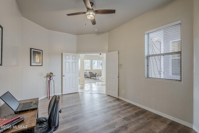 office area with hardwood / wood-style floors and ceiling fan