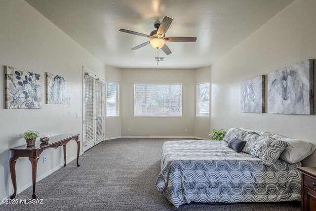 bedroom featuring multiple windows, carpet, and ceiling fan