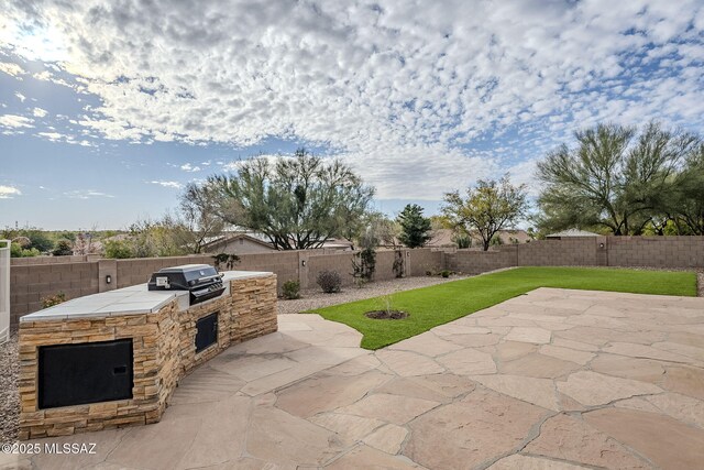 view of patio / terrace with ceiling fan