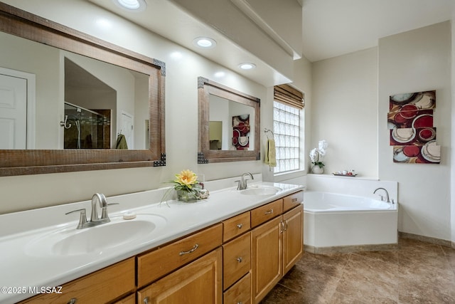 bathroom with vanity and independent shower and bath