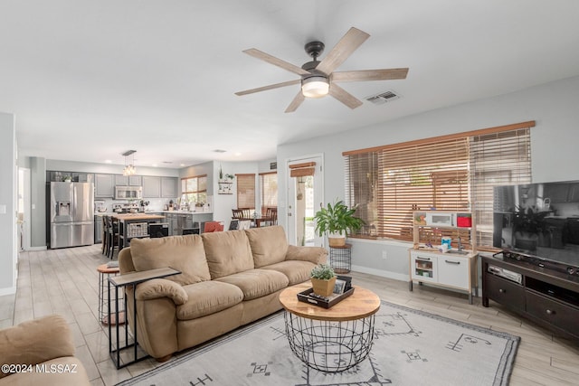 living room with ceiling fan