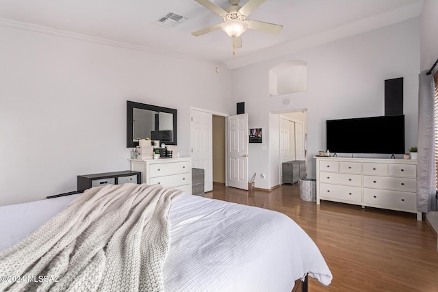 bedroom featuring ceiling fan and dark hardwood / wood-style flooring