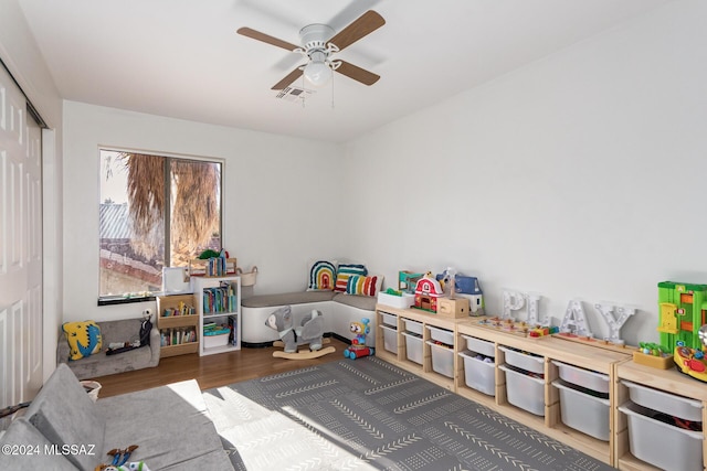 playroom featuring ceiling fan and hardwood / wood-style flooring