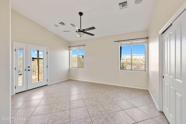 interior space featuring light tile patterned flooring, vaulted ceiling, access to outside, and ceiling fan