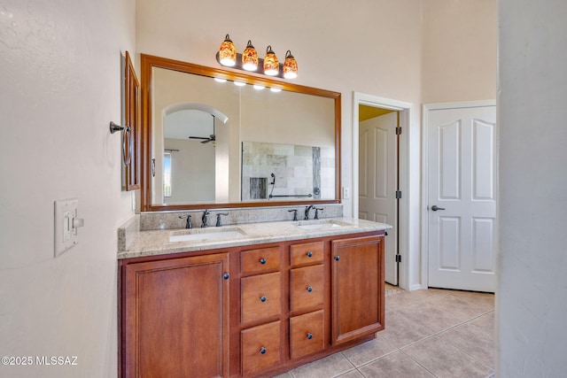 bathroom featuring tile patterned flooring, vanity, and ceiling fan