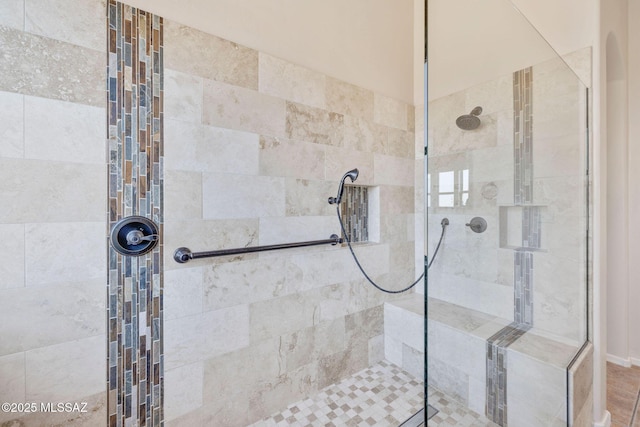 bathroom with tiled shower