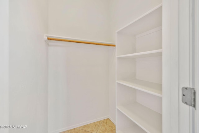 spacious closet with tile patterned flooring