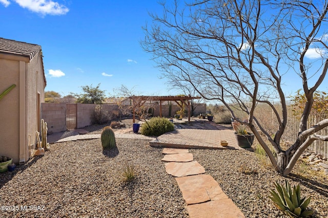 view of yard with a pergola and a patio